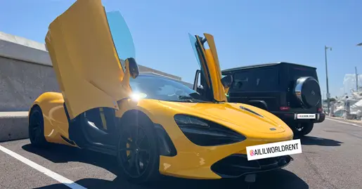 MCLAREN 720S SPIDER IN YELLOW COLOR PARKED AT MARINA PORT WITH BLACK MERCEDES G63 AMG